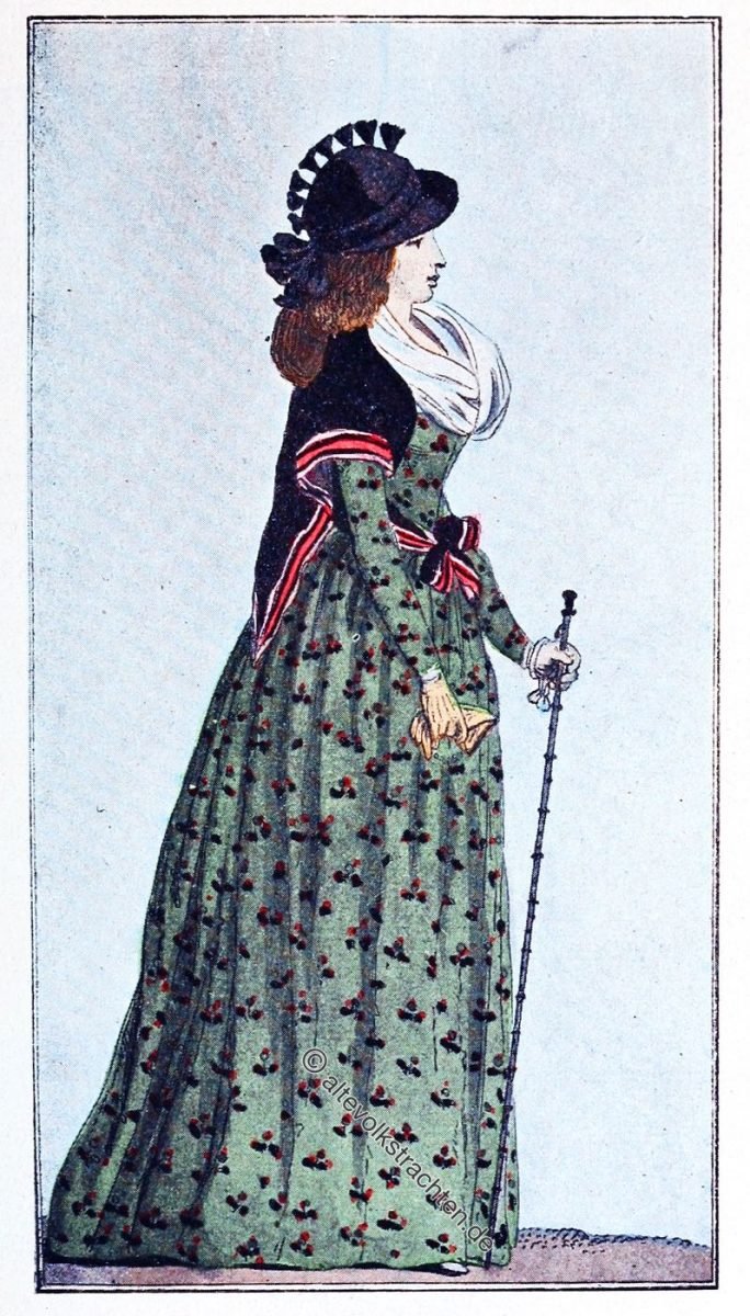 Englisches Etuikleid aus Baumwolle, mit Blumen 1794. Schwarzer Seidenschal, gestreifter Rand, um die Taille gebunden.